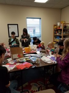 Youth making Valentine's Day Cards for Men at Westside Shelter